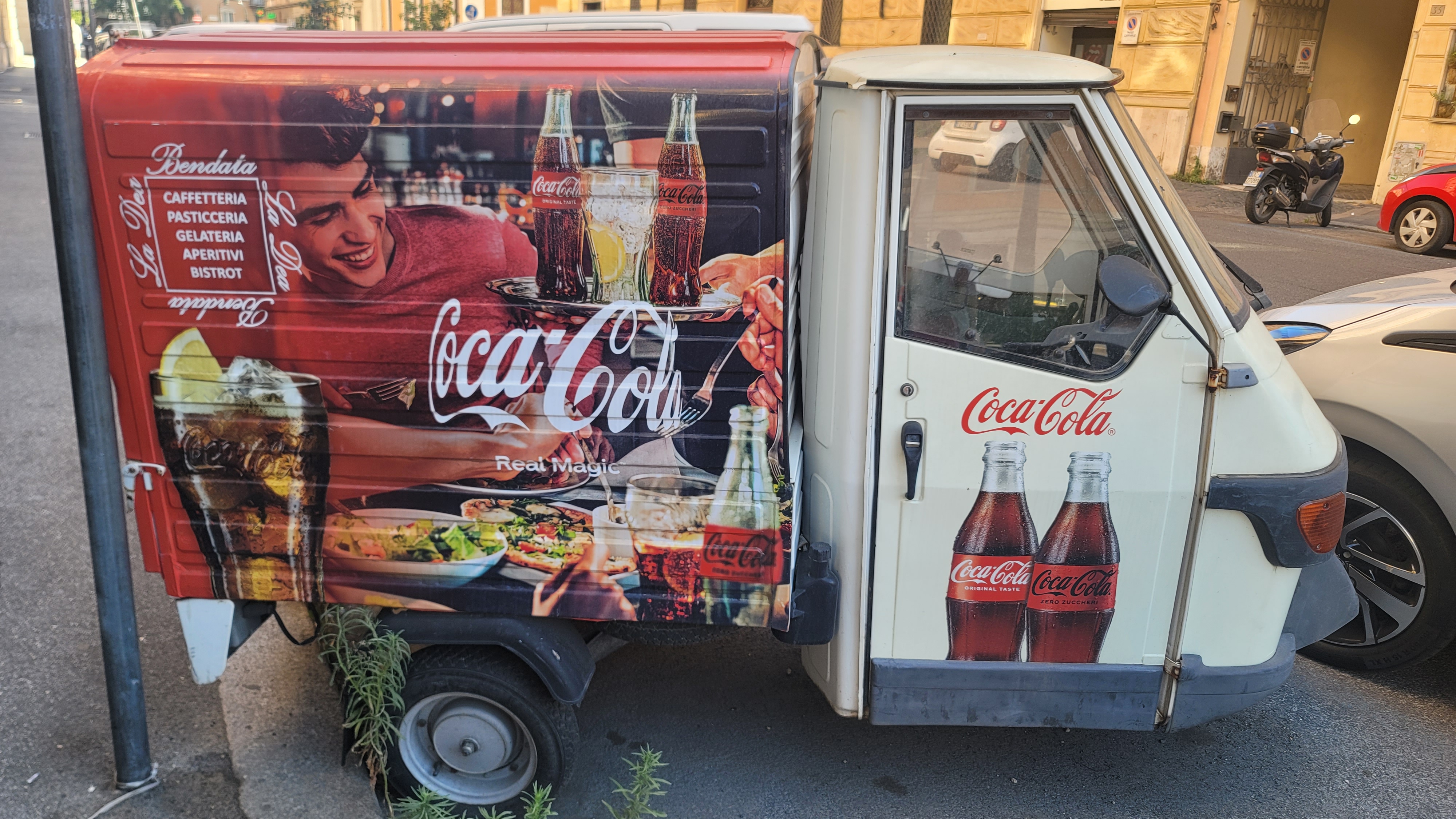 a tiny coca-cola themed took-took